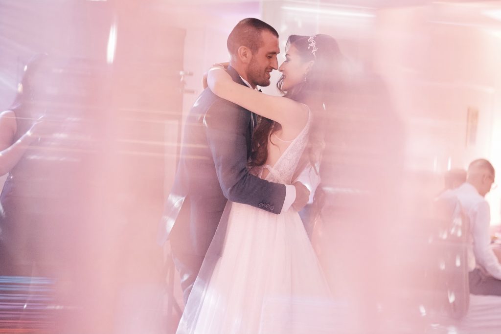Confident couple celebrating choreographed wedding dance routine