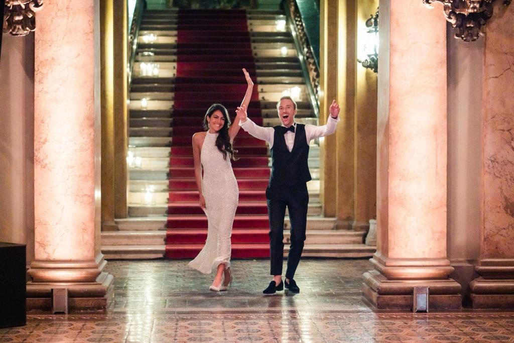 Groom confidently leading the first dance with his bride at their wedding