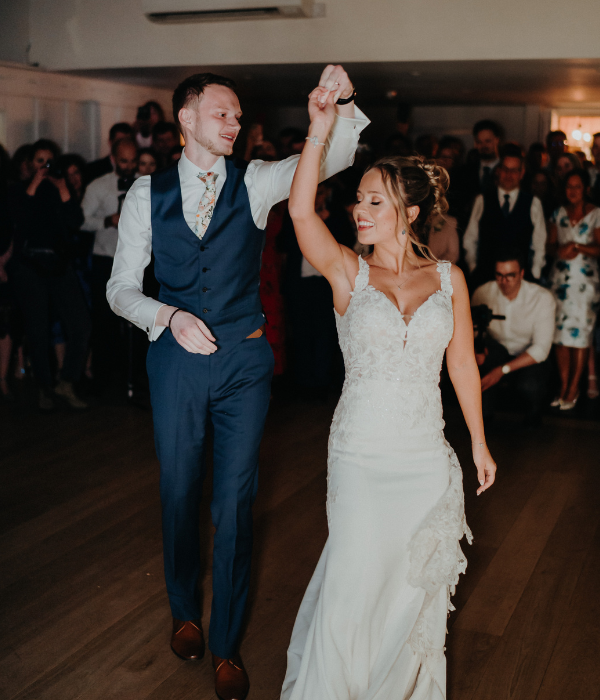 Bride and groom sharing their first dance at their wedding reception