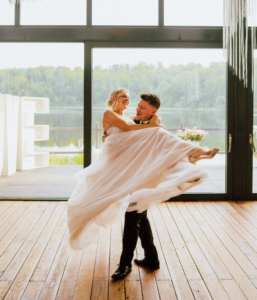Bride and groom smiling during their first dance celebration