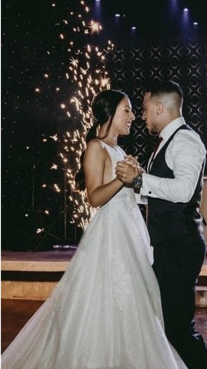 Couple sharing a natural and relaxed first dance during their reception