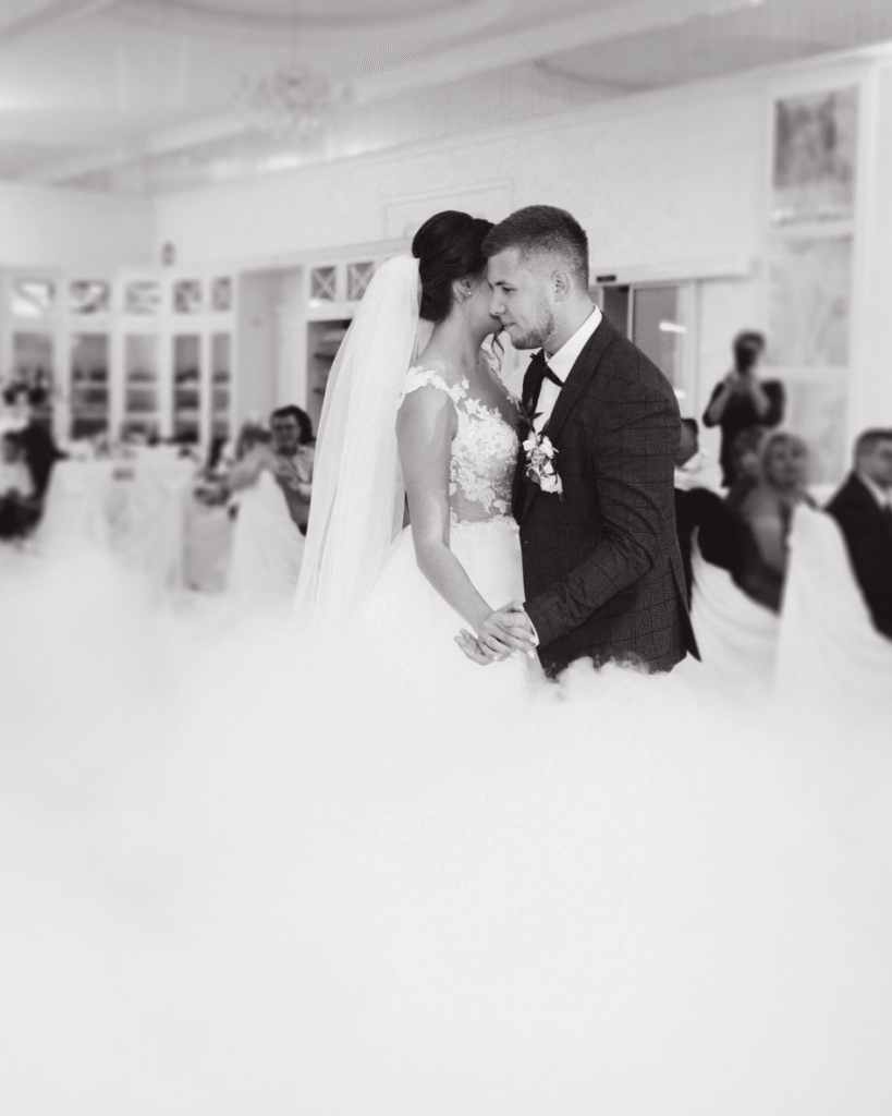 Bride and groom sharing their first dance together at their wedding reception