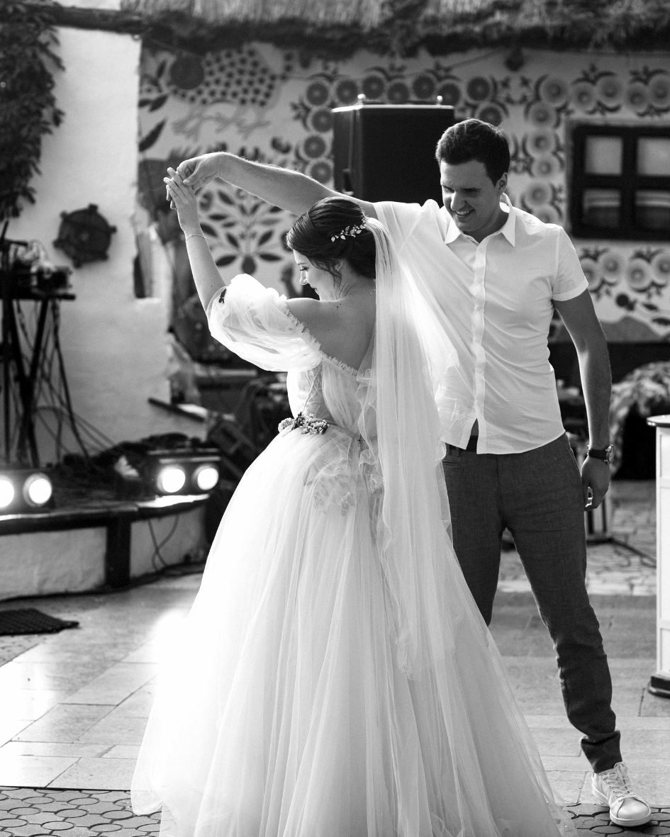 Bride and groom dancing together during their wedding celebration